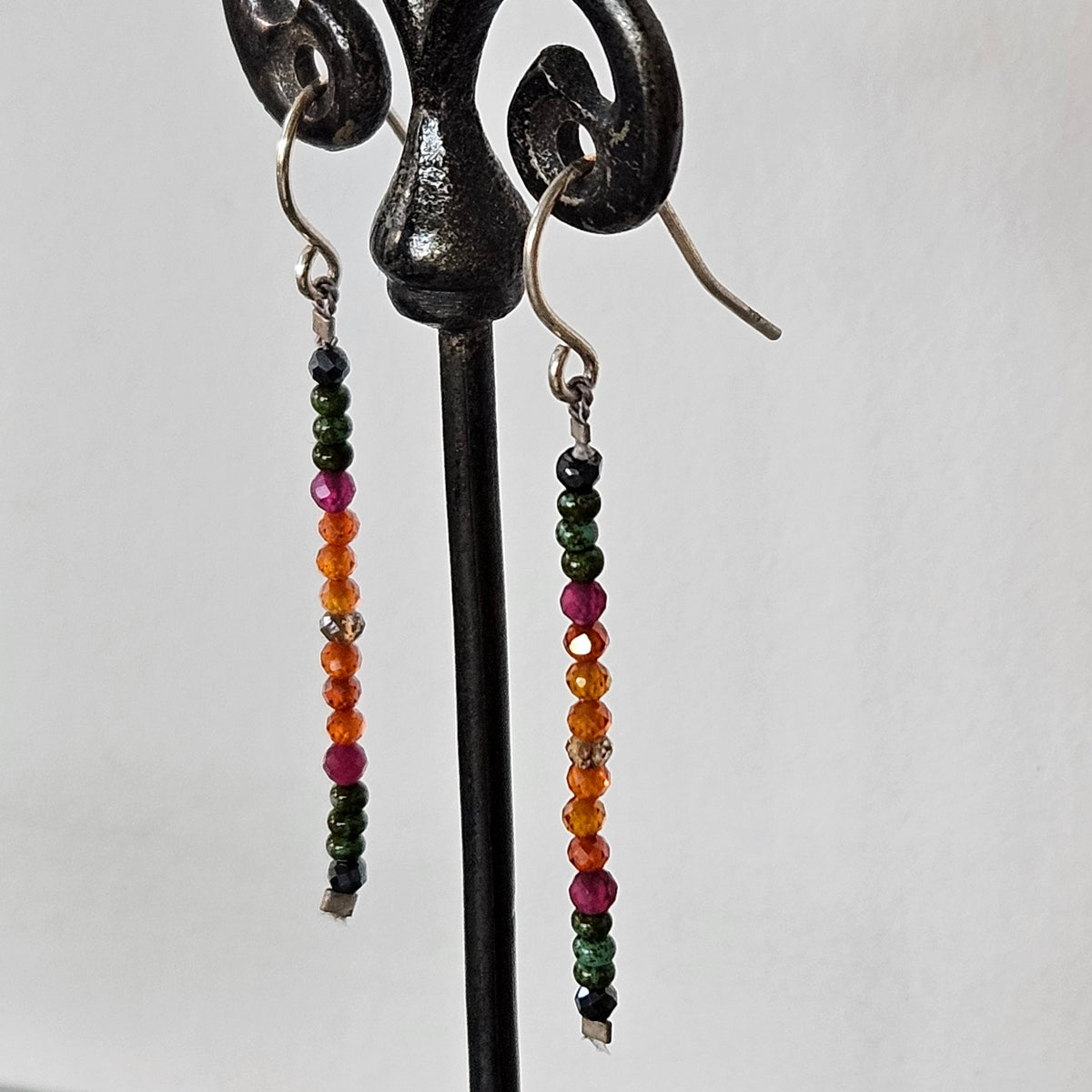 Faceted line of gems earrings in sterling silver, handcrafted by Antiqua Jewelry