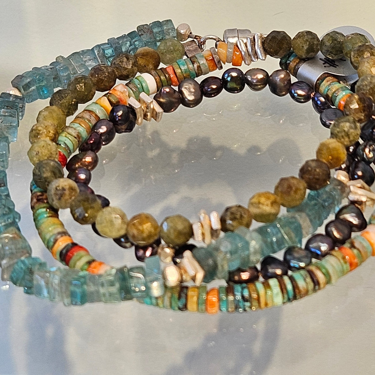 Four strand bracelet, handcrafted by Antiqua Jewelry