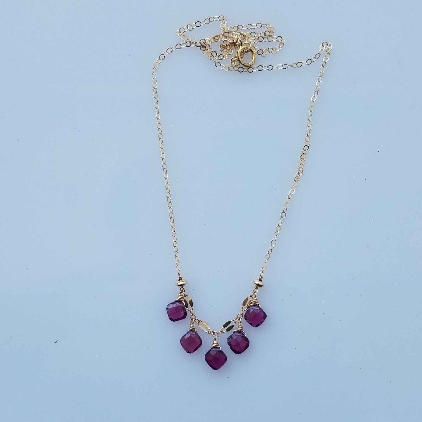 Garnet droplets necklace in red, handcrafted by Antiqua Jewelry