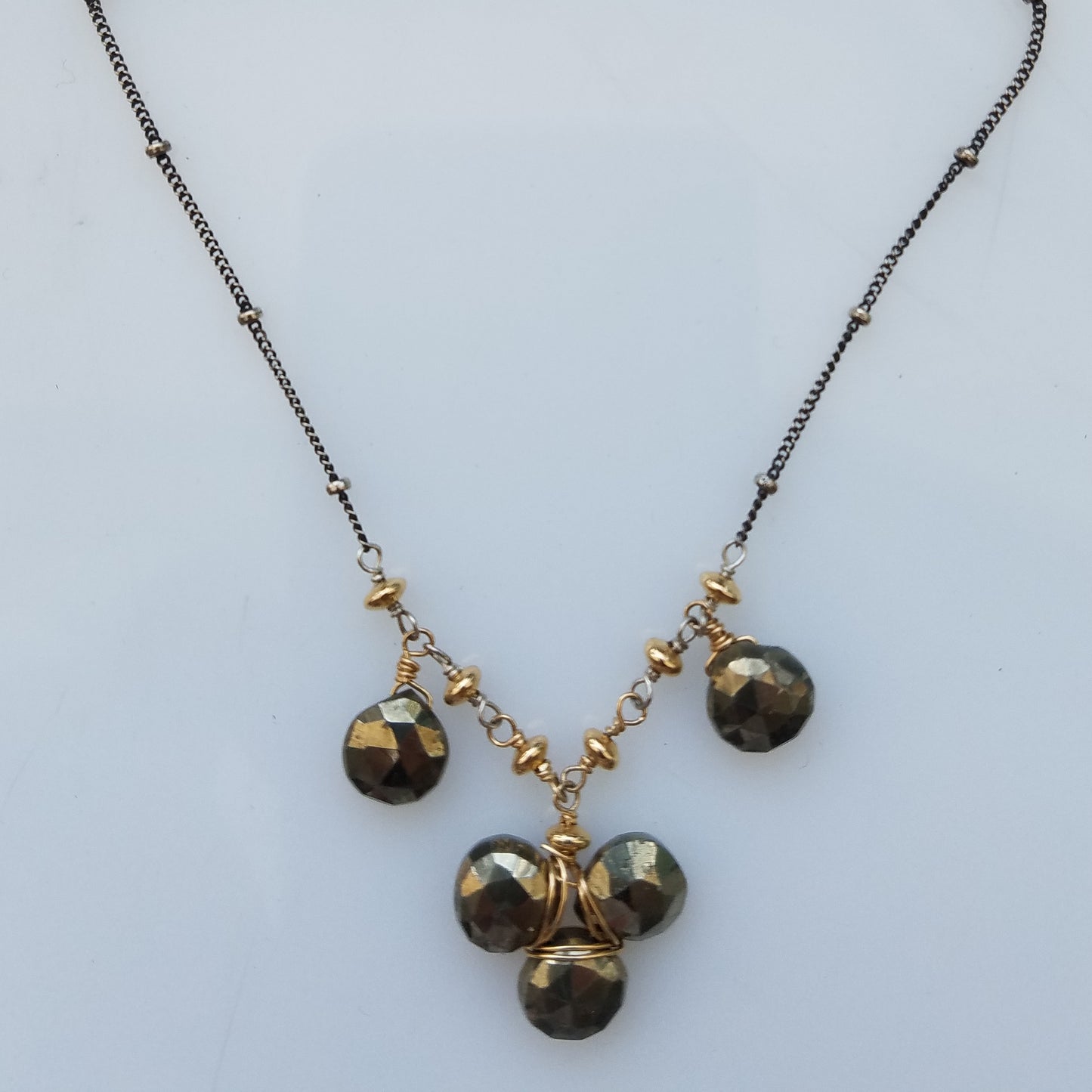 Pyrite clover necklace in gray, handcrafted by Antiqua Jewelry