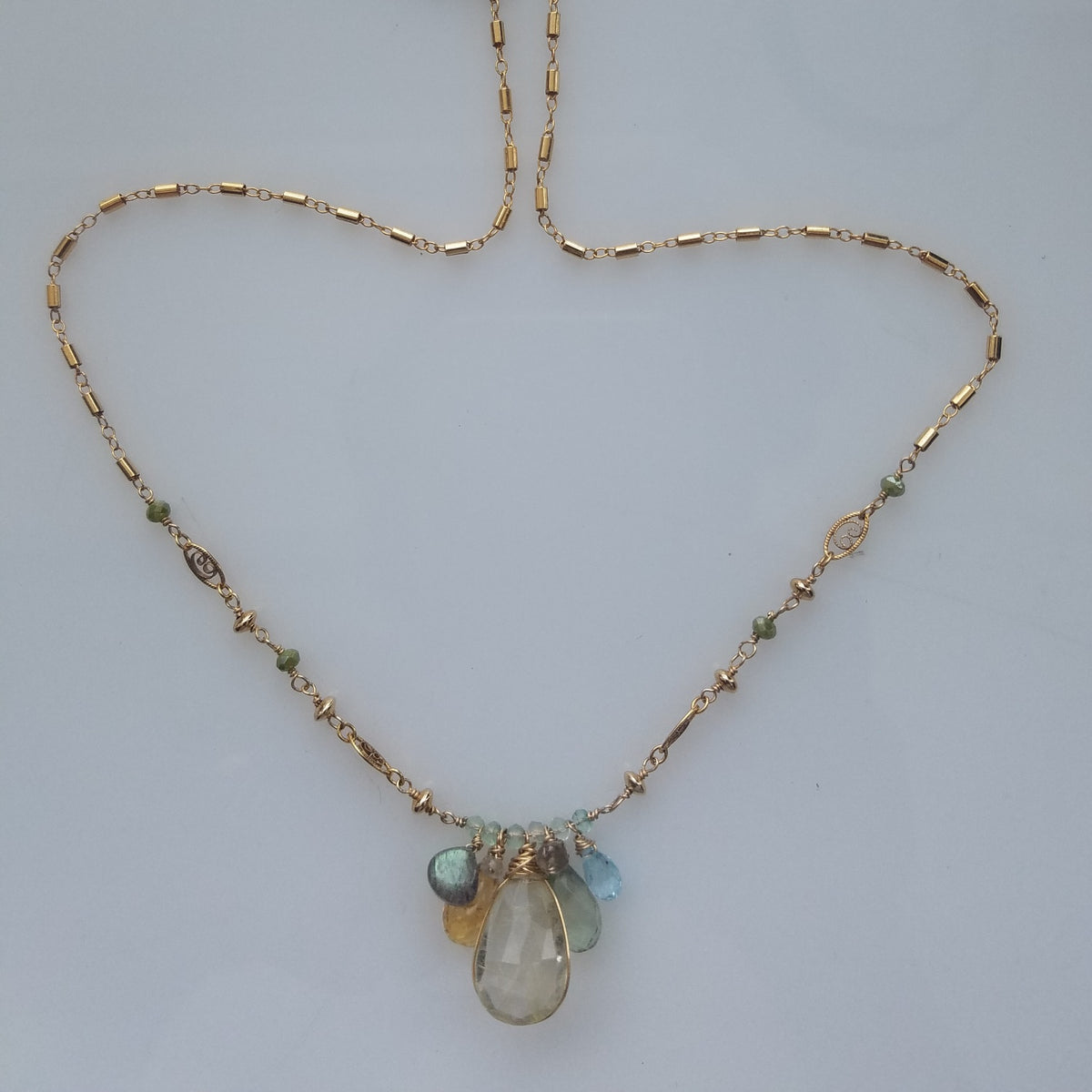Rutilated orchestra necklace, handcrafted by Antiqua Jewelry