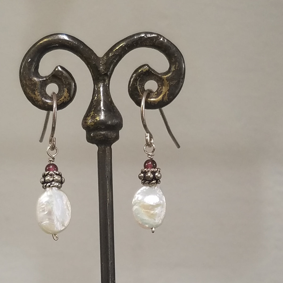 Oval coin pearl earrings in white, handcrafted by Antiqua Jewelry