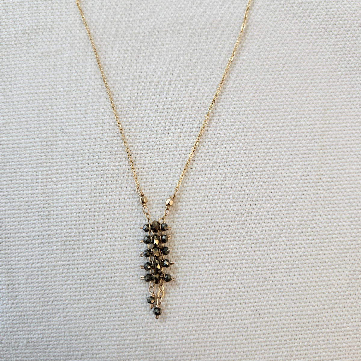 Tiny Pyrite necklace in gray, handcrafted by Antiqua Jewelry