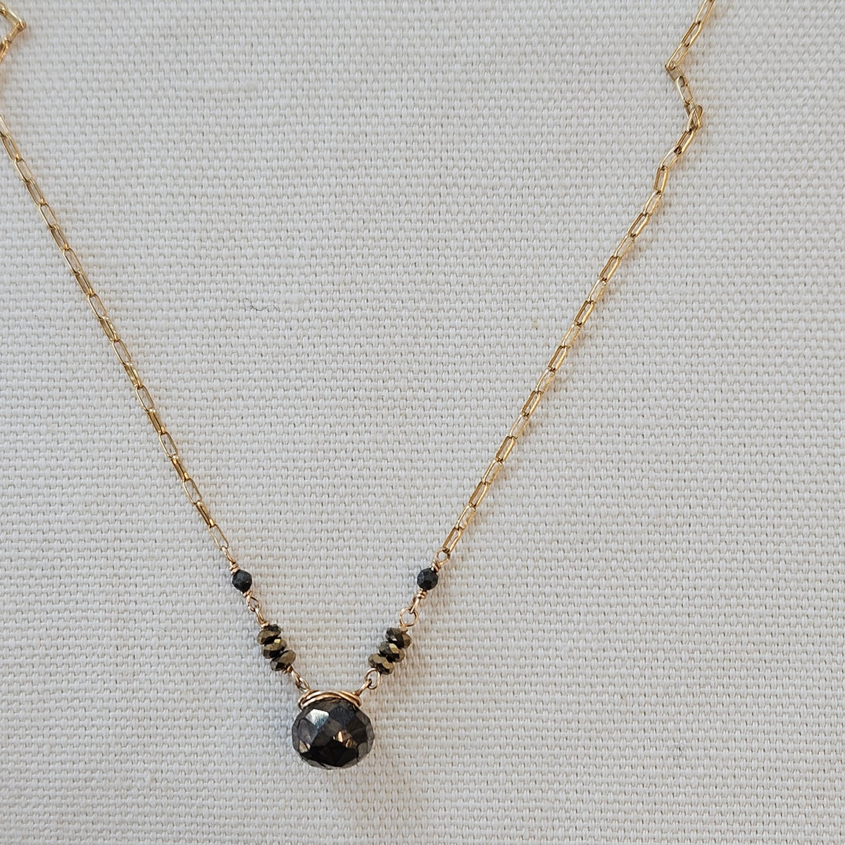 Layering Pyrite necklace in gold and gold, handcrafted by Antiqua Jewelry
