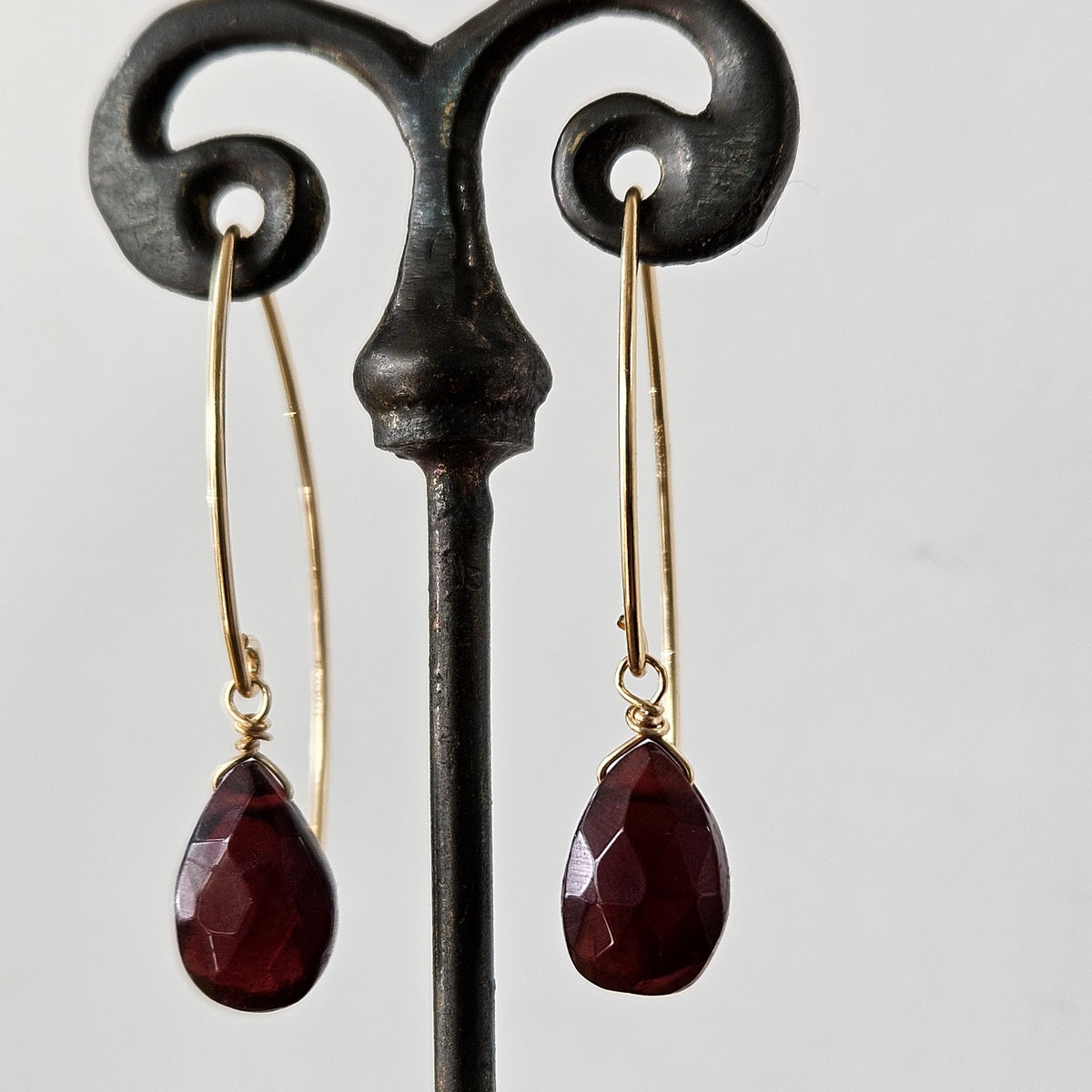 Garnet drop earrings in red and gold, handcrafted by Antiqua Jewelry