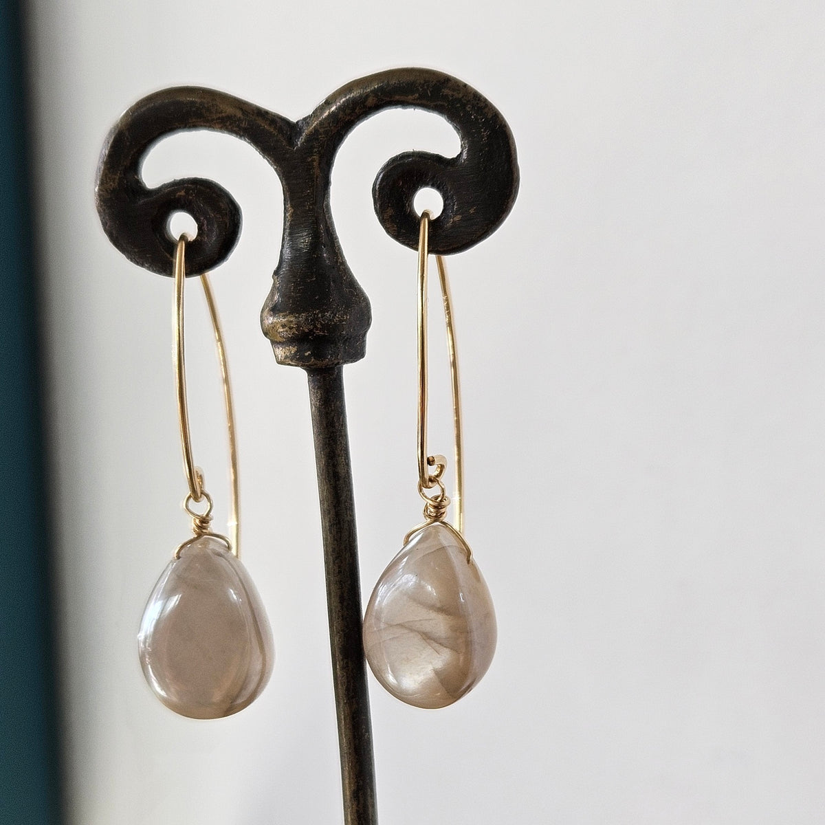 Lustrous Moonstone earrings in gold and gold, handcrafted by Antiqua Jewelry
