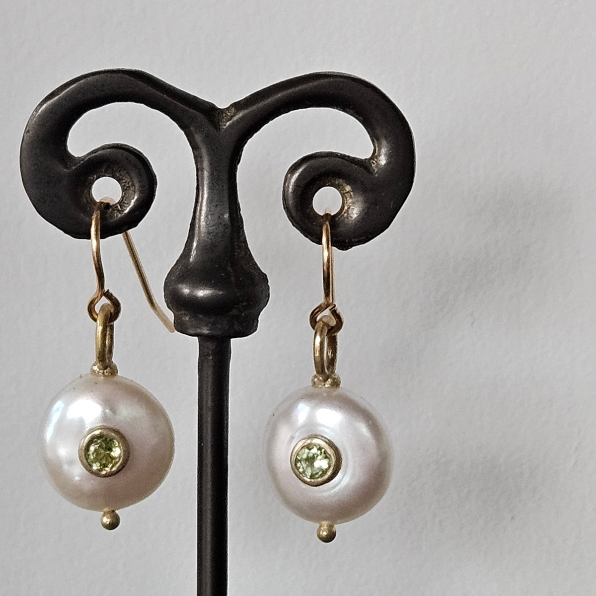 Peridot Pearl earrings in white and gold, handcrafted by Antiqua Jewelry