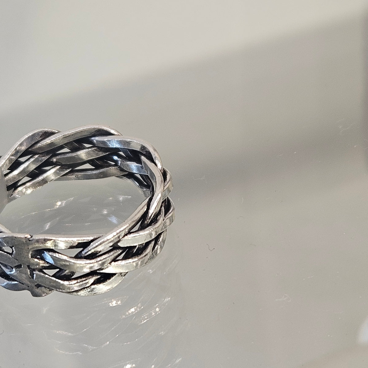 Braided Man Ring in silver and sterling silver, handcrafted by Antiqua Jewelry