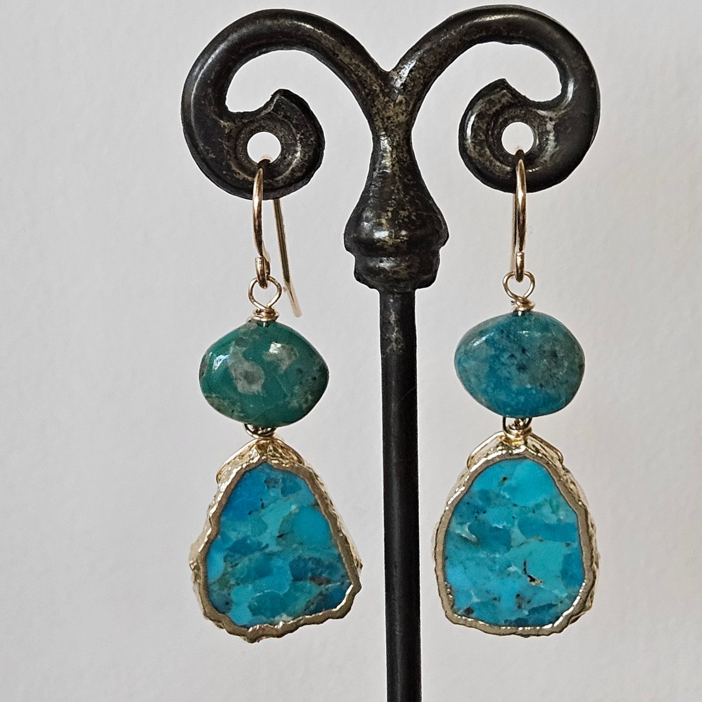 Flat oval Turquoise earrings in blue and gold, handcrafted by Antiqua Jewelry
