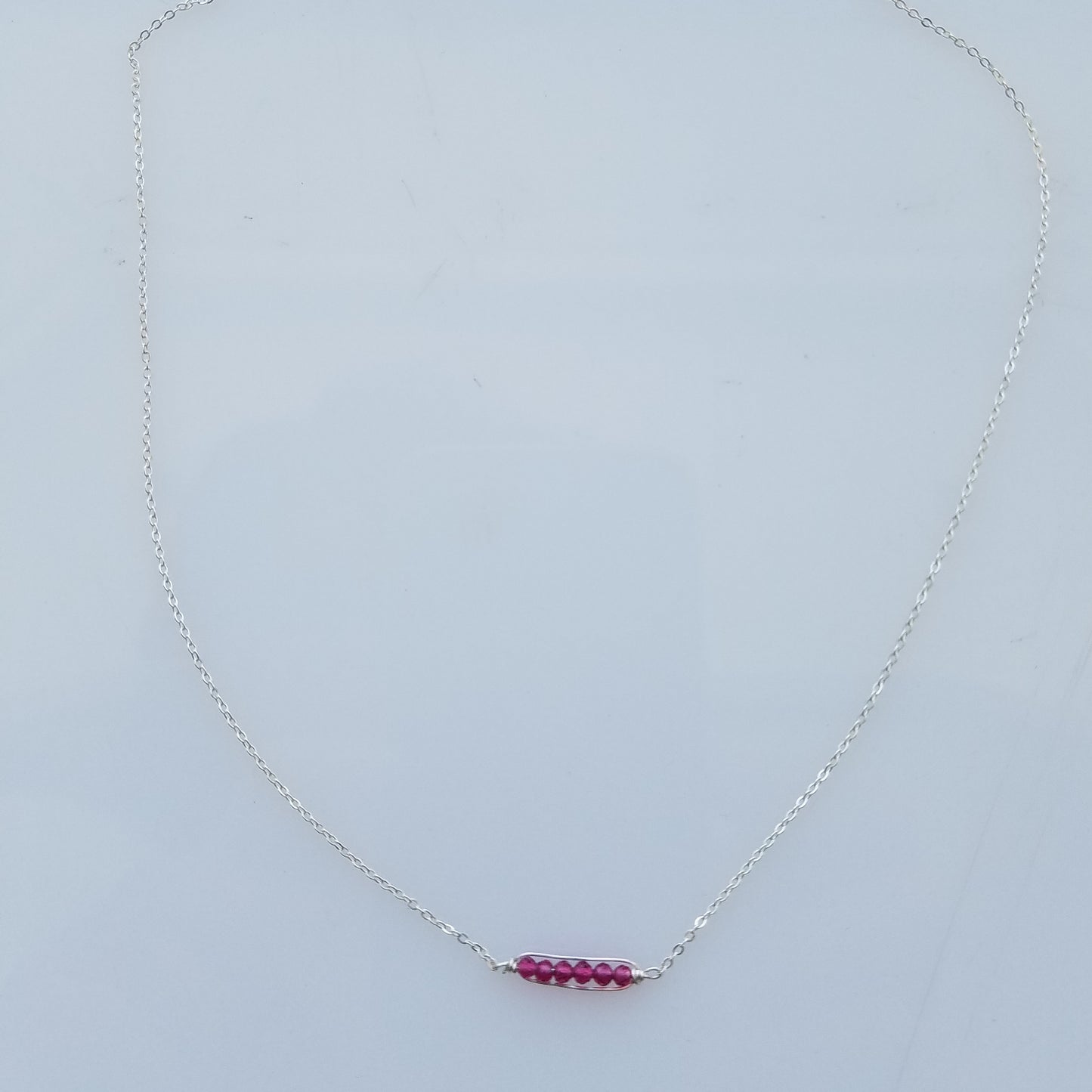 Dainty garnet necklace in red, handcrafted by Antiqua Jewelry