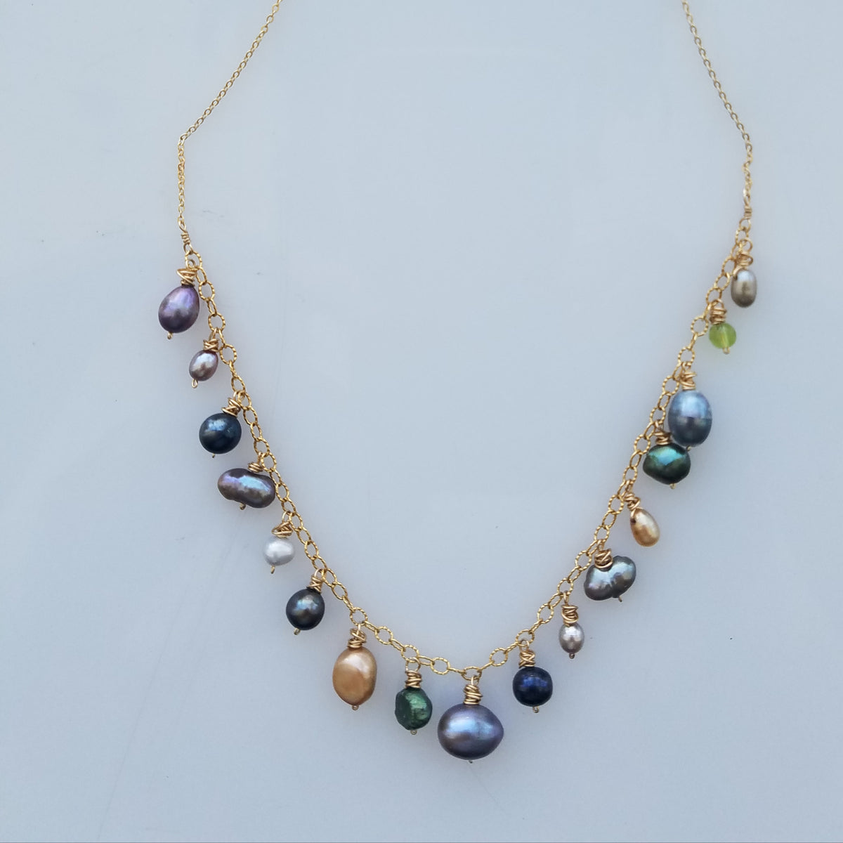 Shades of Pearls necklace in white, handcrafted by Antiqua Jewelry