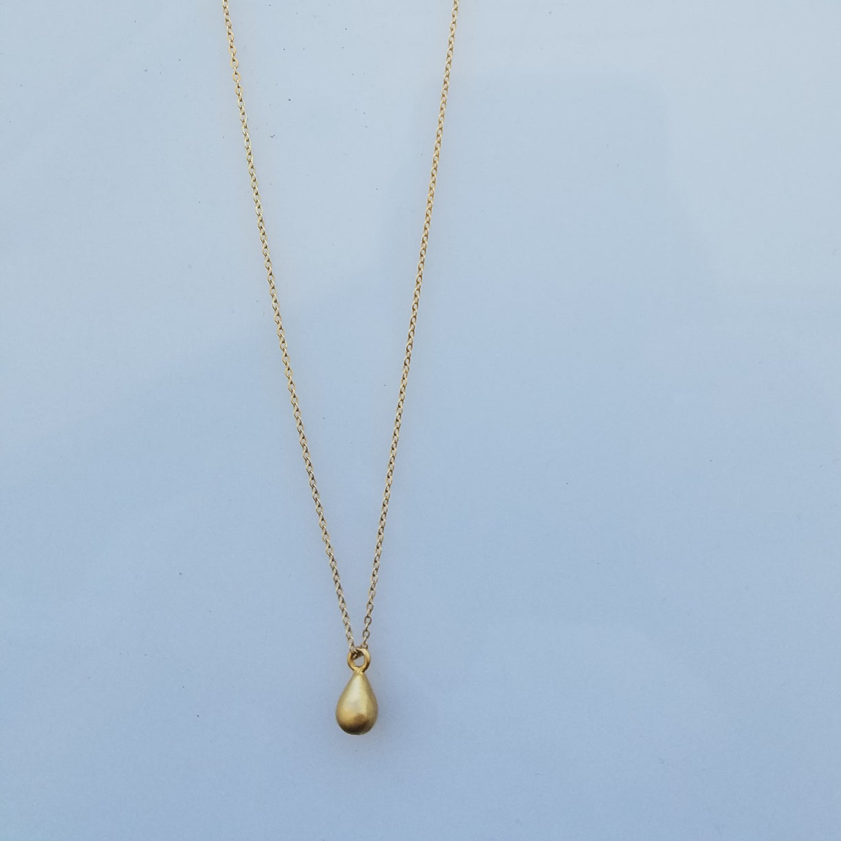 Golden drop necklace, handcrafted by Antiqua Jewelry