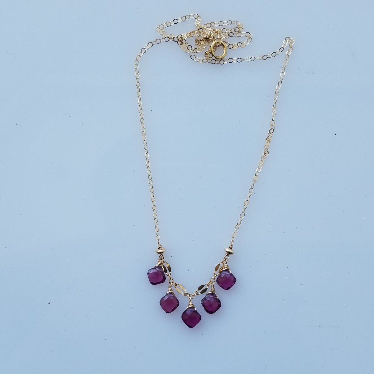 Garnet droplets necklace in red, handcrafted by Antiqua Jewelry
