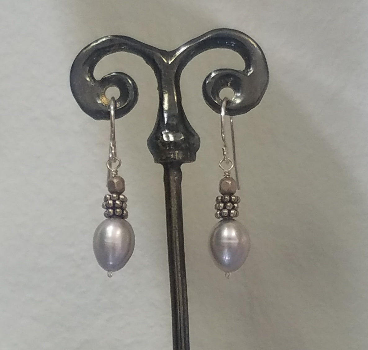 Silver pearl earrings in white, handcrafted by Antiqua Jewelry