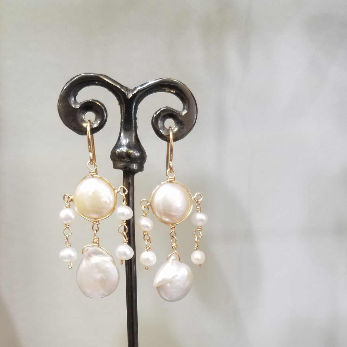 White pearls chandelier earrings, handcrafted by Antiqua Jewelry