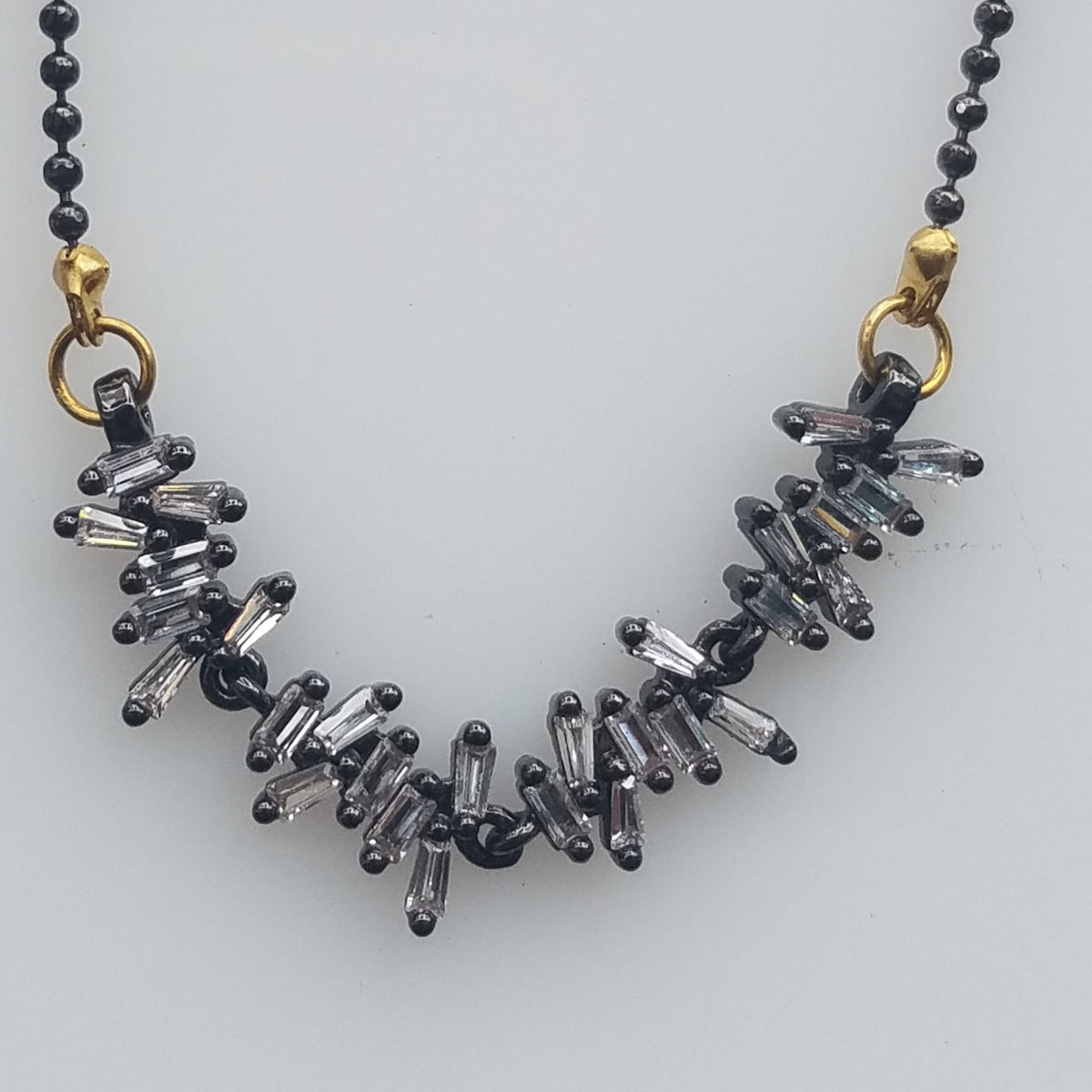 Bugguette Zirconias necklace, handcrafted by Antiqua Jewelry