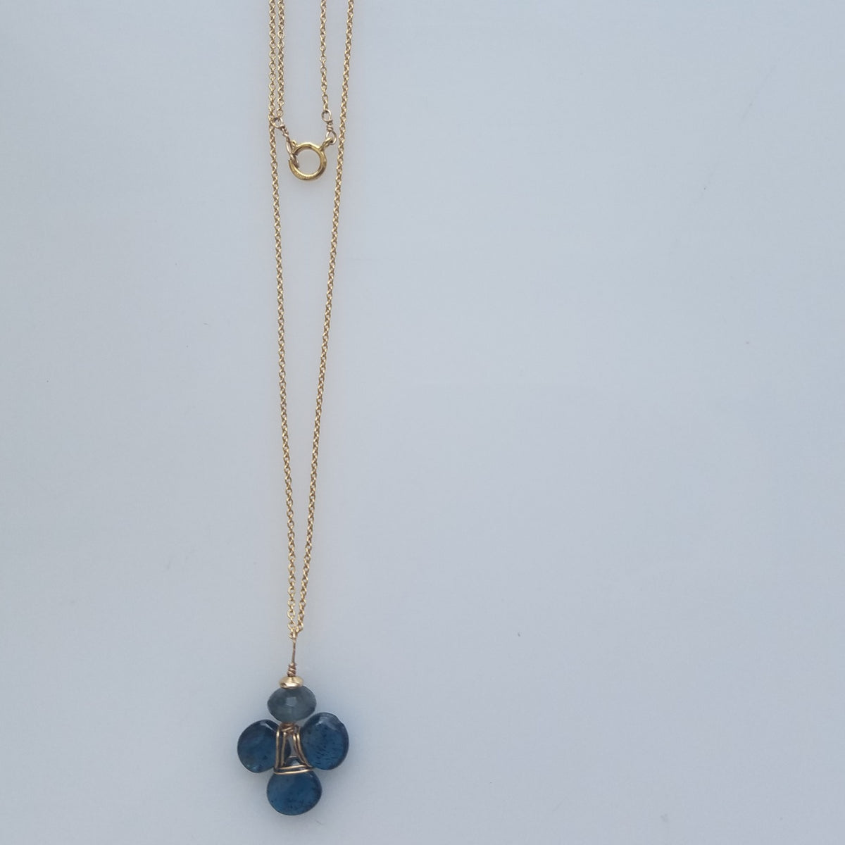 Blue Kyanite clover necklace, handcrafted by Antiqua Jewelry