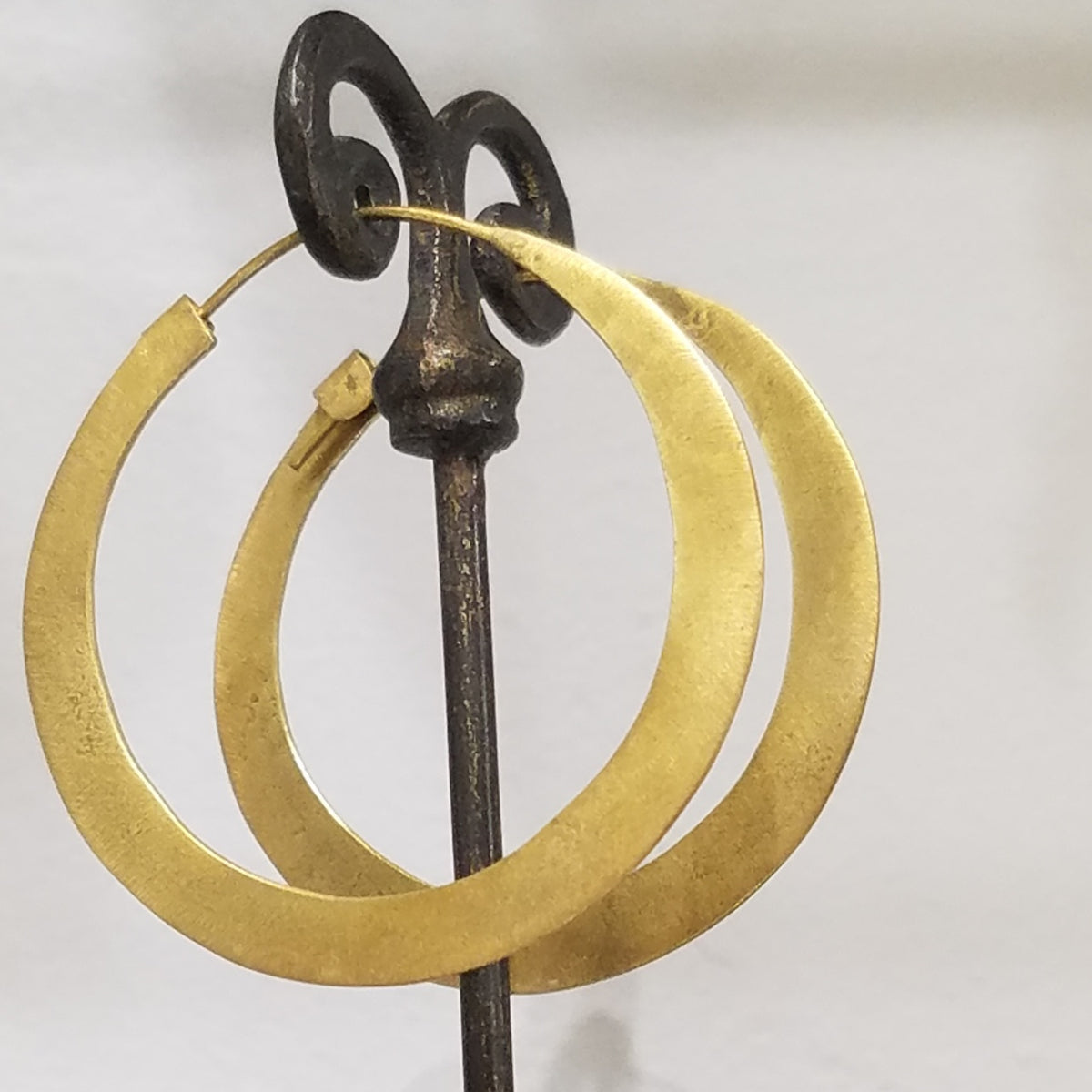 Brass hoop earrings in gold, handcrafted by Antiqua Jewelry