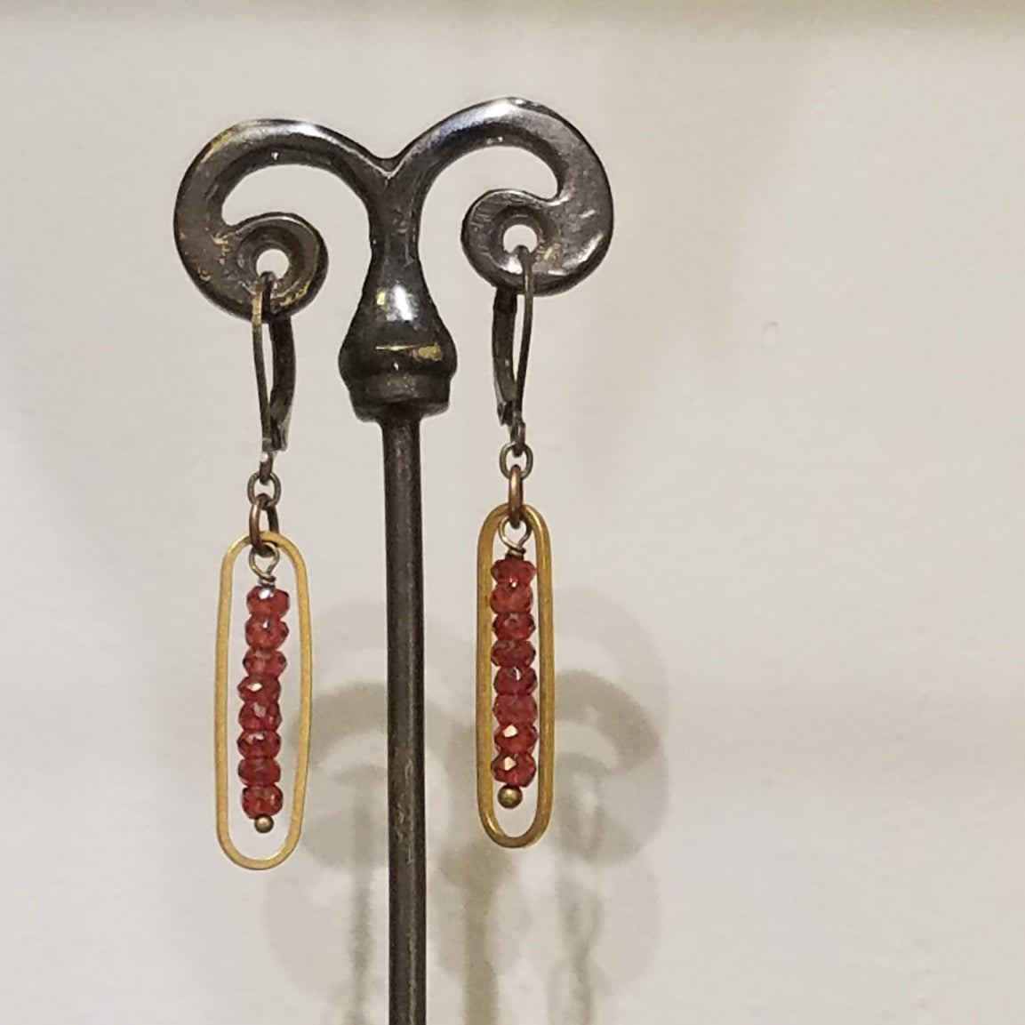 Encased Garnet earrings in red, handcrafted by Antiqua Jewelry