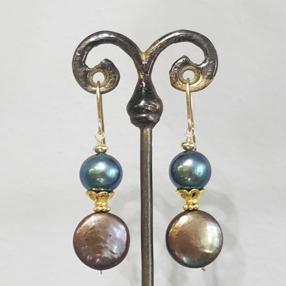 Crowned pearl earrings in white, handcrafted by Antiqua Jewelry
