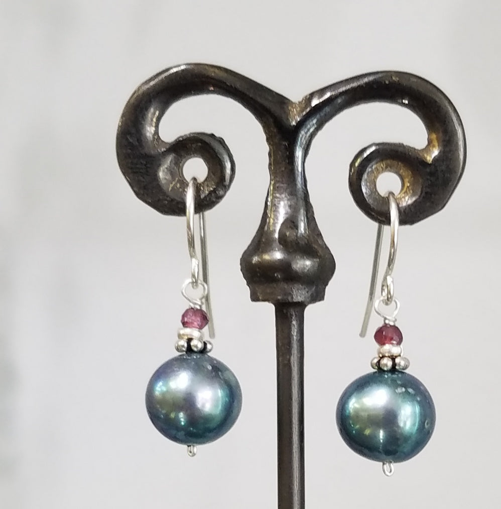 Lustrous blue pearl and garnet earrings, handcrafted by Antiqua Jewelry