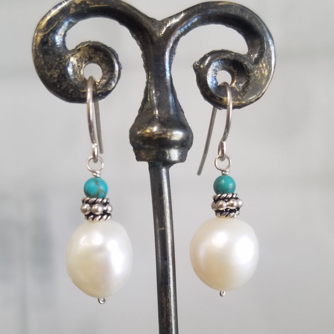 Classic pearl earrings in white, handcrafted by Antiqua Jewelry