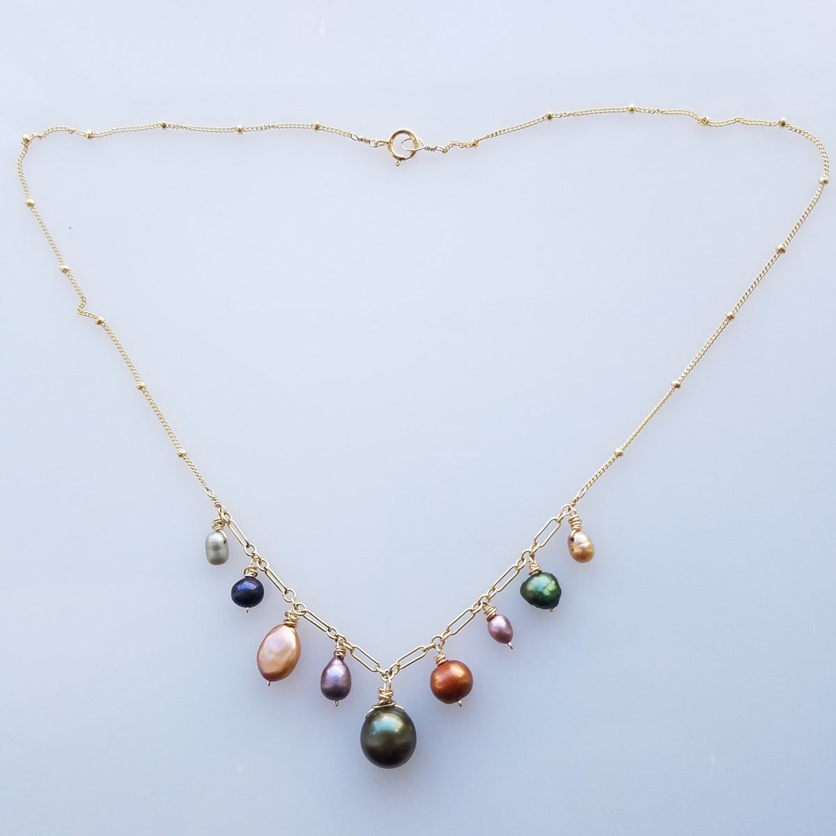 Warm color pearls necklace in white, handcrafted by Antiqua Jewelry