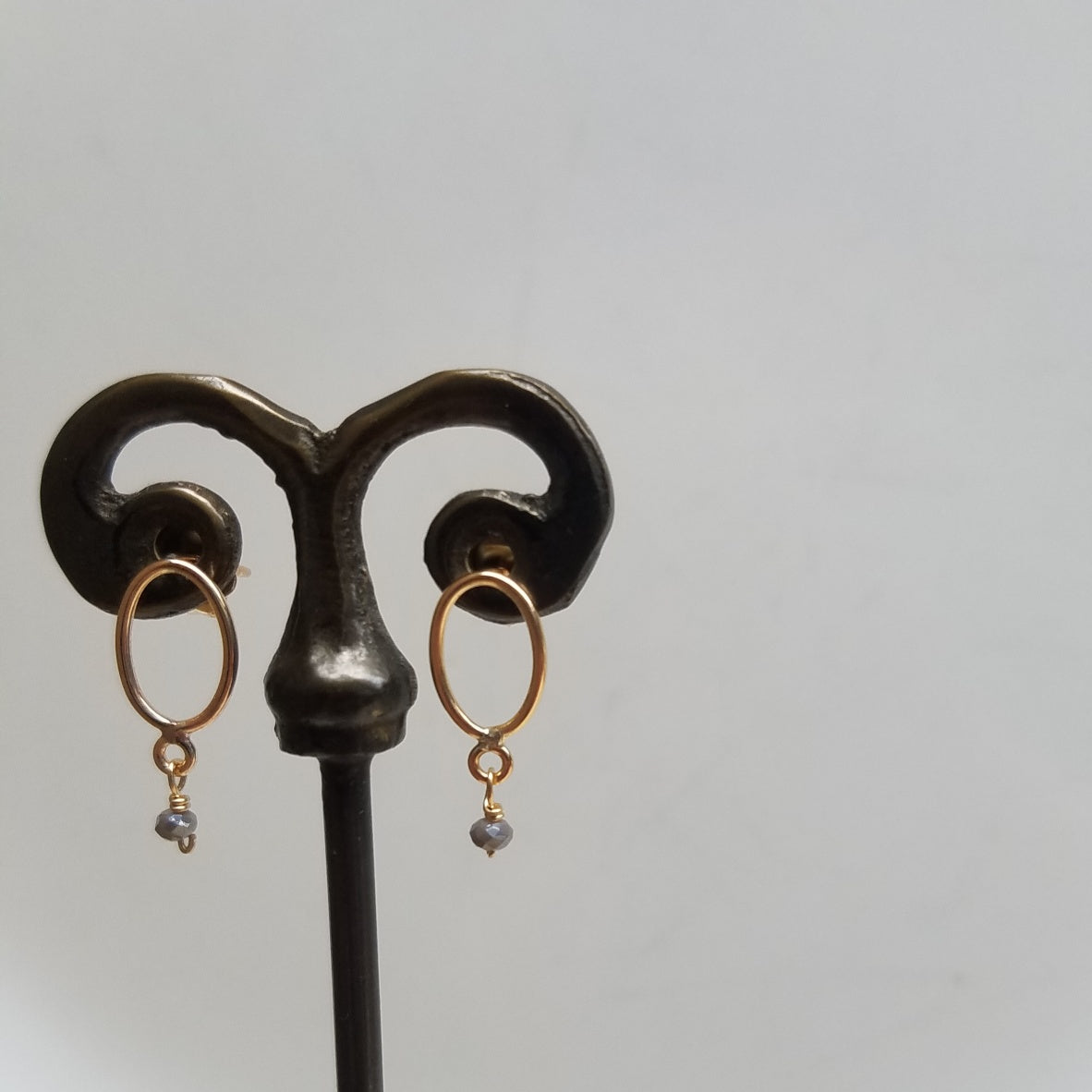 Golden pair of posts/hoops earrings, handcrafted by Antiqua Jewelry