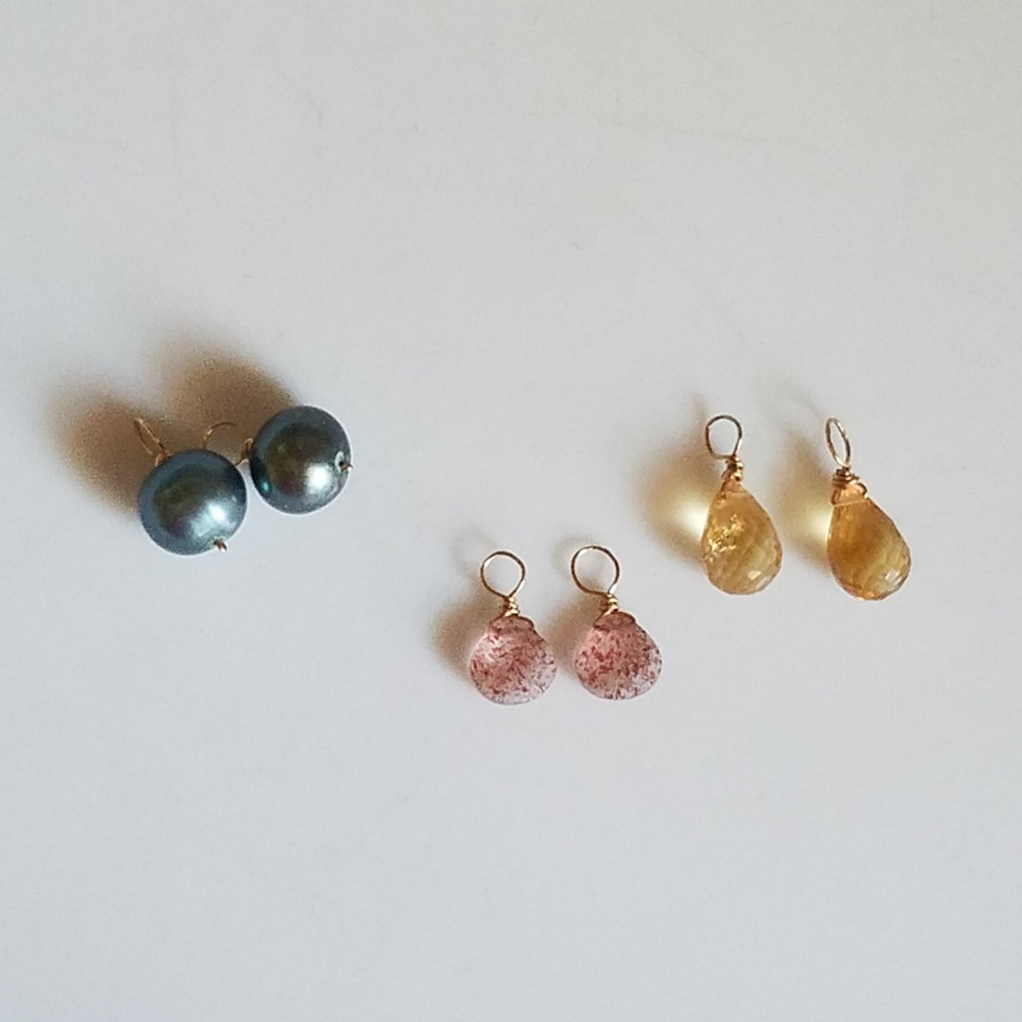 Pink, blue and yellow charms for hoop earrings, handcrafted by Antiqua Jewelry