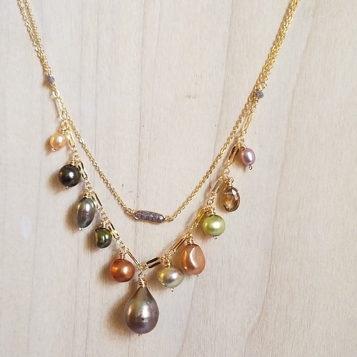 The many shades of Pearls necklace in white, handcrafted by Antiqua Jewelry