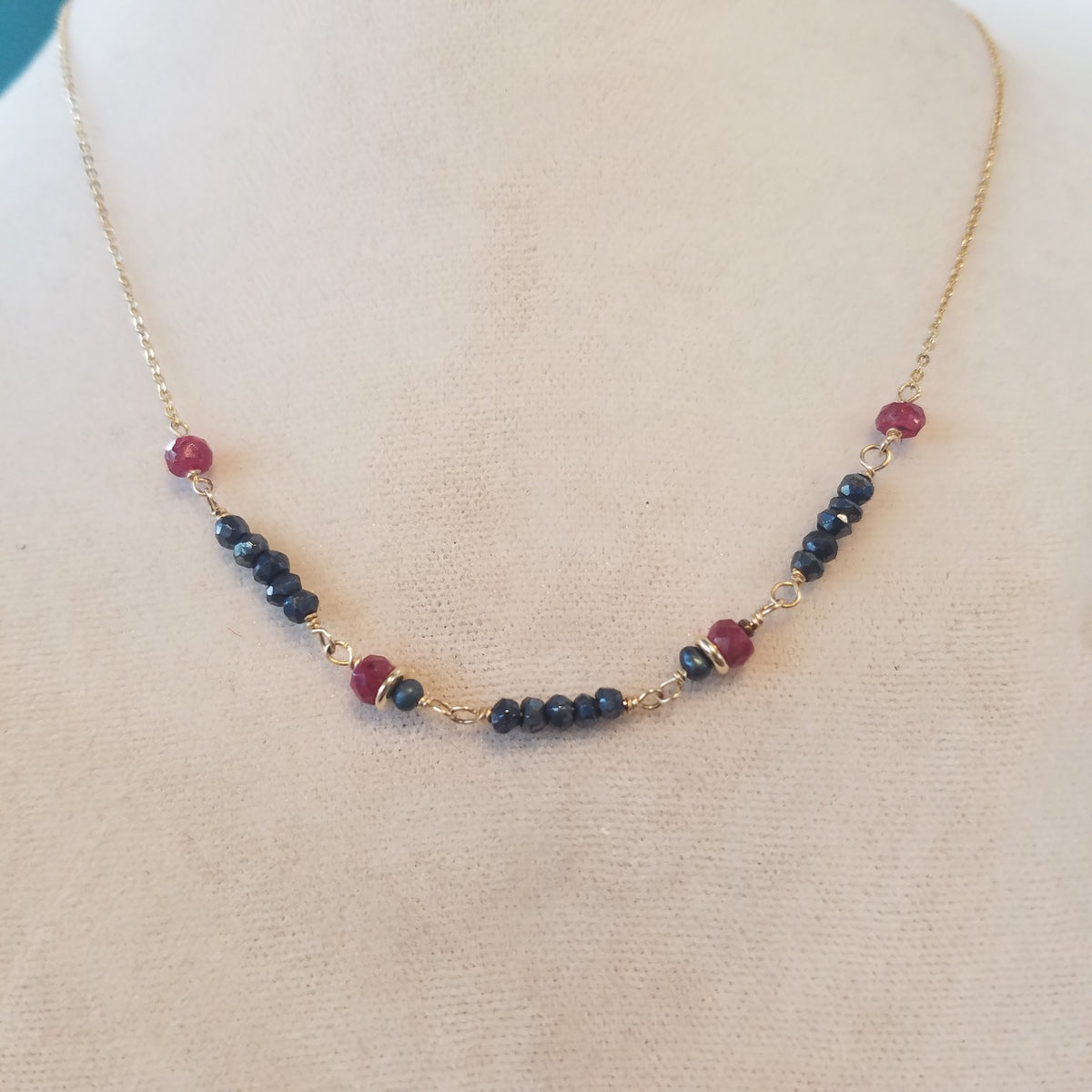 Rubys and Pyrite necklace in gray, handcrafted by Antiqua Jewelry